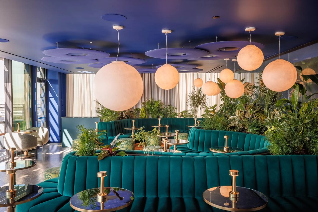 teal booths inside a bar