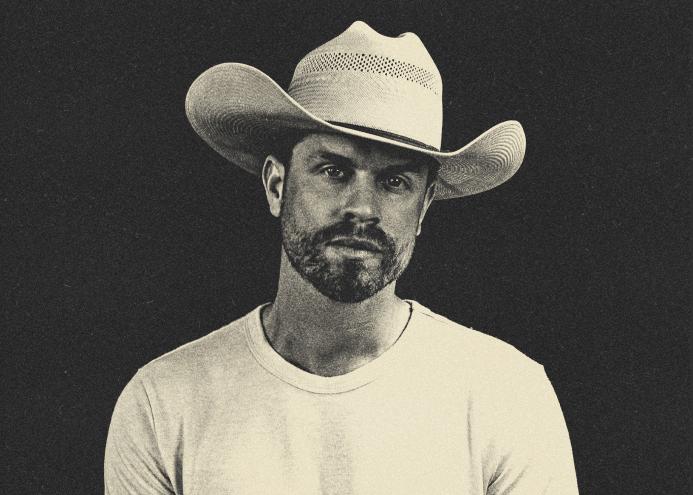 man in a white cowboy hat