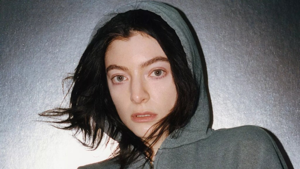 the singer Lorde in a grey sweatshirt