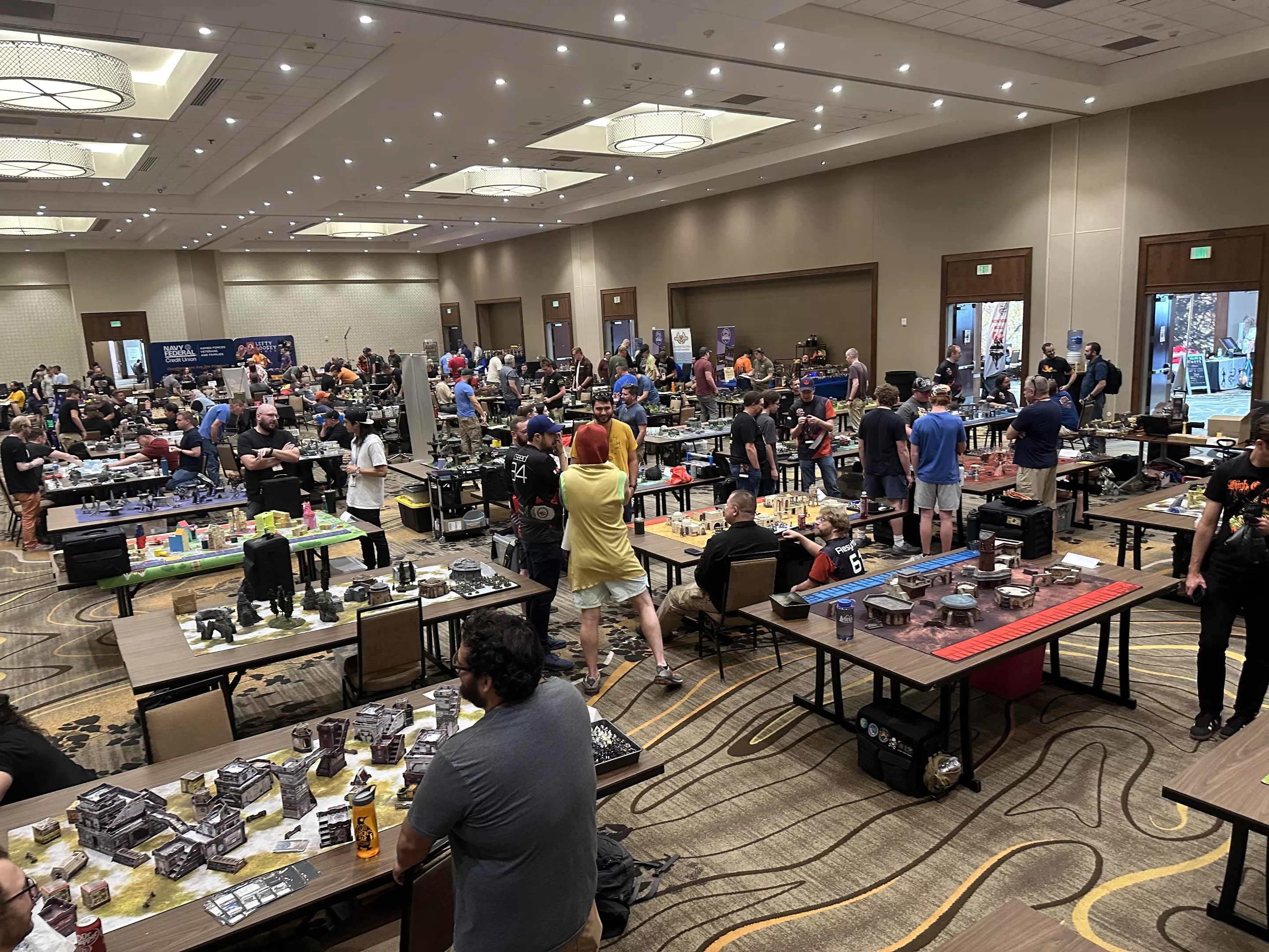 A crowded room of tabletop gamers