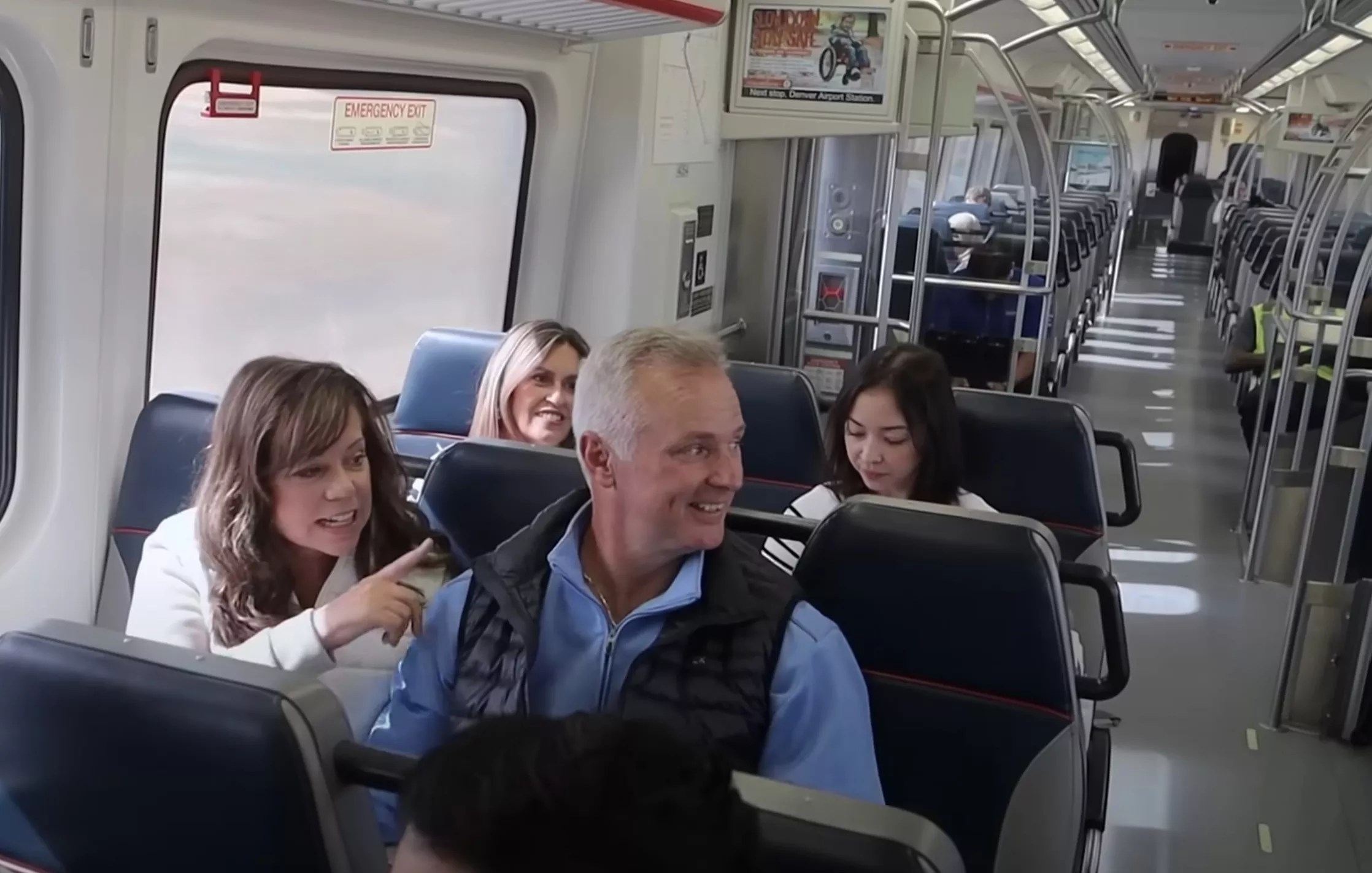 People sit on a train