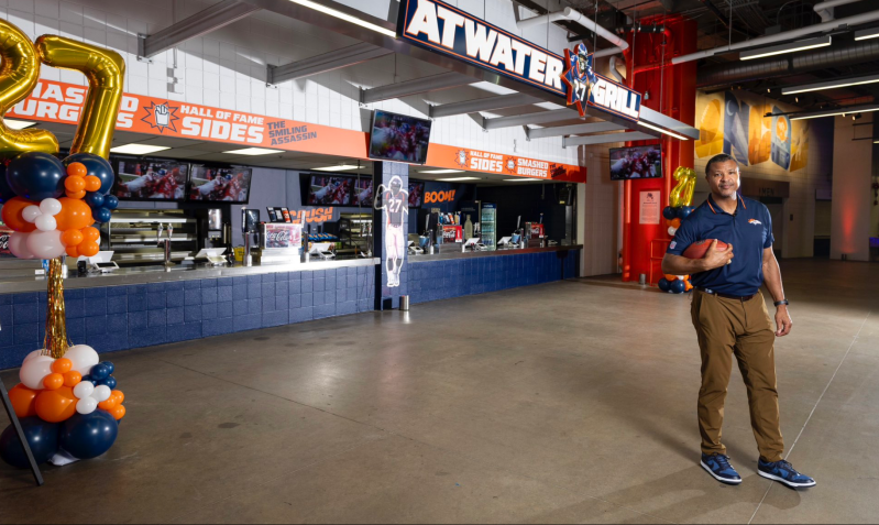 football player in front of food counter