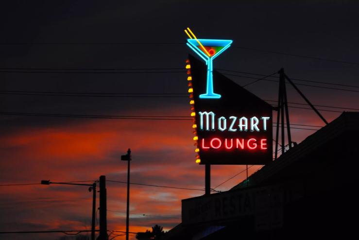 A lit up sign reading "Mozart Lounge"